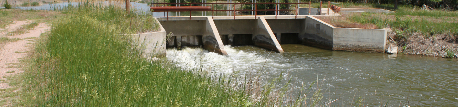 Water rushing through open gates at a damn