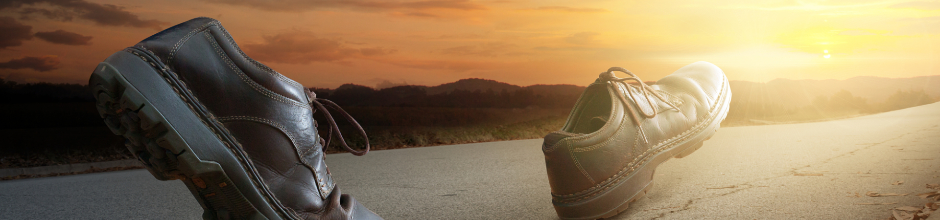 Close up of boots walking on a road